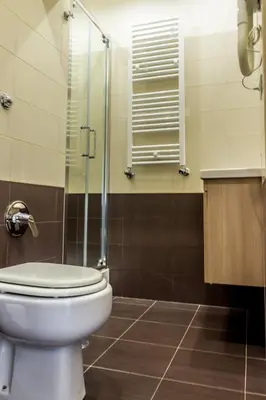 a bathroom with a toilet and a glass shower at San Pietro's Home - Guesthouse in Rome