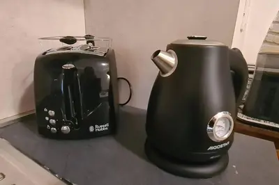 a coffee maker and a toaster sitting on a counter at MON CHERI COLOSSEO in Rome