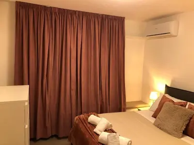 a hotel room with a bed and a window at MON CHERI COLOSSEO in Rome