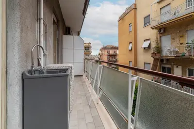 a balcony with a sink on the side of a building at GuestHost - Monteverde Quattro Venti Apartment in Rome