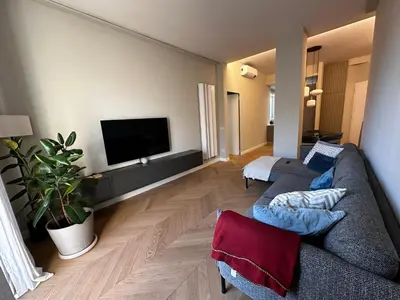 a living room with a couch and a flat screen tv at Giulia’s Corner in Rome
