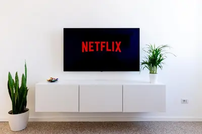 a tv sitting on top of a white cabinet at Adventura Penthouse in Rome