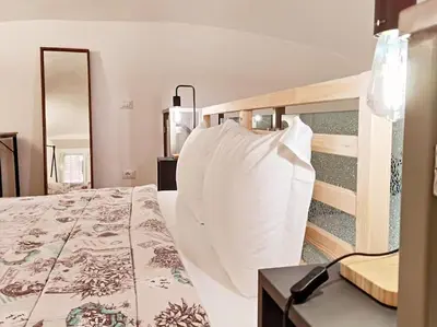 a bedroom with a bed with a large pillow at Testaccio Industrial Loft in Rome