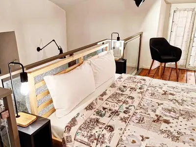 a bedroom with a bed and a desk with a chair at Testaccio Industrial Loft in Rome