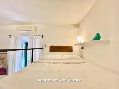 a small room with a bed and a window at Vacanze Romane Colosseum in Rome