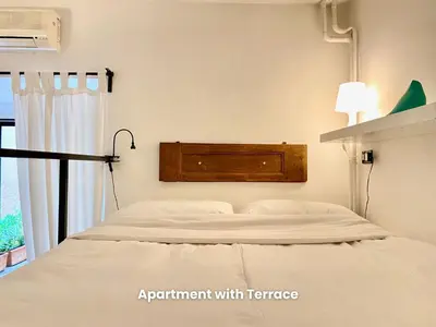 a bedroom with a bed with a headboard at Vacanze Romane Colosseum in Rome