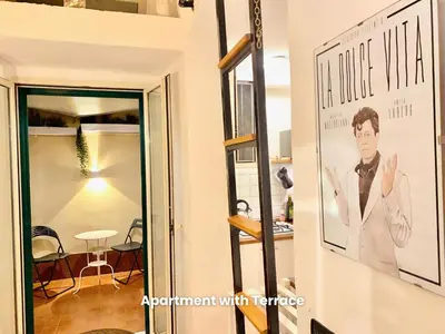 a framed picture of a man on a wall in a room at Vacanze Romane Colosseum in Rome