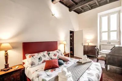a bedroom with a large bed in a room at Borgo Pio Passetto Papale in Rome