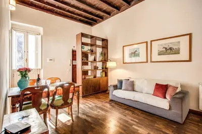 a living room with a couch and a table at Borgo Pio Passetto Papale in Rome