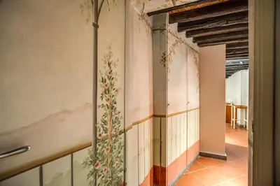 a hallway with a painting on the wall at Cartari Apartment in Rome