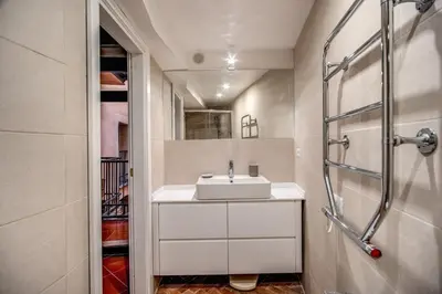 a bathroom with a sink and a shower at Cartari Apartment in Rome