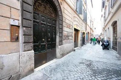 an alley with people walking down a street at FIORE home Rome Center Campo dè Fiori in Rome