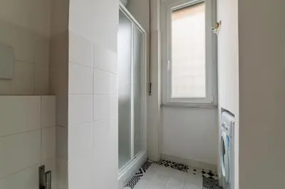 a bathroom with a shower and a window at GuestHost - Piazza Bainsizza Elegant Apartment in Rome