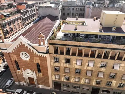 an overhead view of a building with a clock on it at Casa Per Ferie Casa Cabrini in Rome