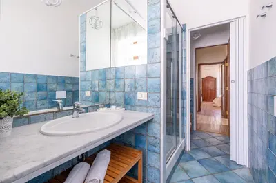 a bathroom with a sink and a mirror at Vista Indimenticabile sulla Cupola di S. Pietro in Rome