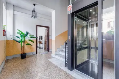 an entrance to a building with a glass door at Klioos Apartment Testaccio in Rome