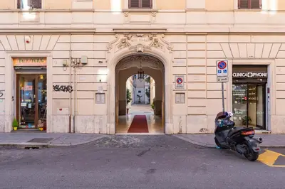 a scooter parked in front of a building at Klioos Apartment Testaccio in Rome