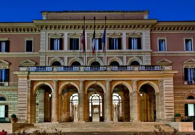 a large building with two flags in front of it at Caterina Apt San Lorenzo 2camere in Rome