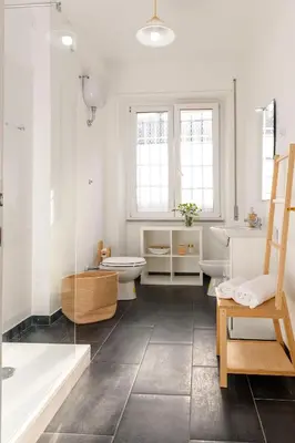 a bathroom with a tub and a toilet and a sink at San Giovanni Home in Rome