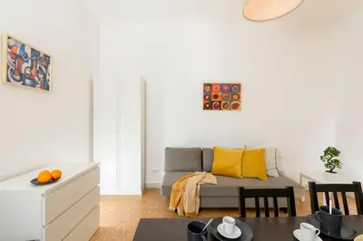 a living room with a couch and a table at San Giovanni Home in Rome