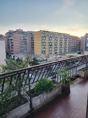 a view of a city from a balcony with buildings at Home Sweet Home Tiburtina Station in Rome