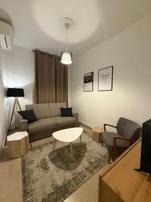 a living room with a couch and a table at Pietra Apartment,Colosseo in Rome
