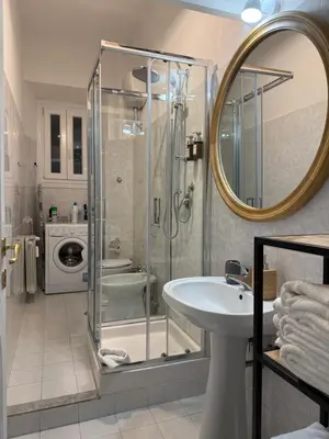 a bathroom with a shower and a sink at Pietra Apartment,Colosseo in Rome