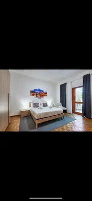 a large bedroom with a large bed in it at Anastasio II apartment in Rome