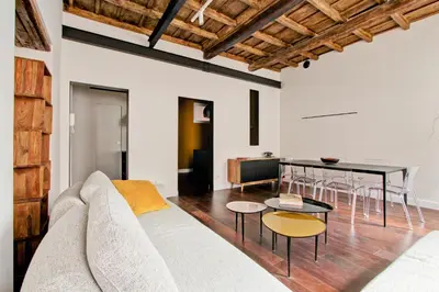 a living room with a couch and a table at CoroCoro114 Comfort ed Eleganza in Rome