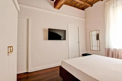 a bedroom with a white bed and a window at CoroCoro114 Comfort ed Eleganza in Rome