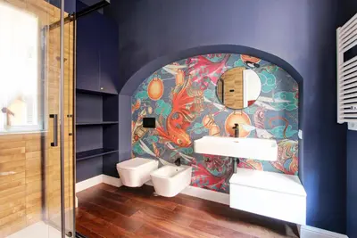 a bathroom with a sink and a colorful wall at CoroCoro114 Comfort ed Eleganza in Rome