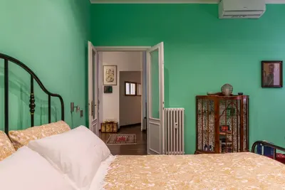 a bathroom with a sink and two toilets at GuestHost - Piazza di Roma Turquoise Apartment in Rome