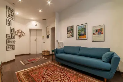 a bathroom with a toilet and a sink at GuestHost - Piazza di Roma Turquoise Apartment in Rome