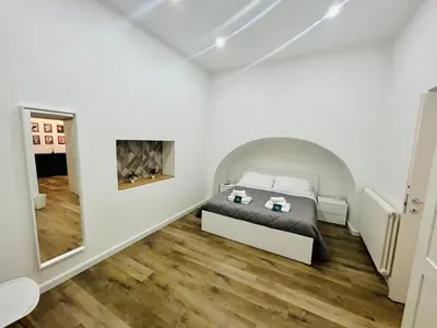 a bedroom with a bed and a fireplace at Boiardo Art House in Rome