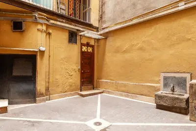 a corner of a building with a door and a courtyard at GuestHost - Campo de Fiori Unique Apartment in Rome
