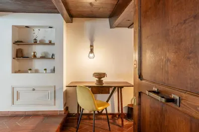 a room with a desk and a chair and a table at Historical Loft at Campo de Fiori in Rome