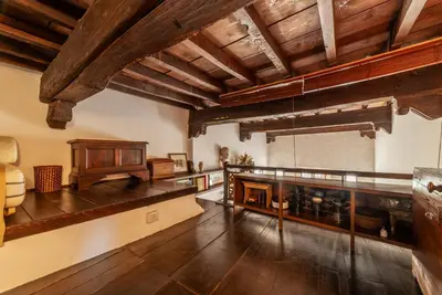 a large room with wooden ceilings and wooden floors at Historical Loft at Campo de Fiori in Rome