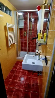 a bathroom with a white sink and a shower at Wanderlust Pietralata B&B in Rome