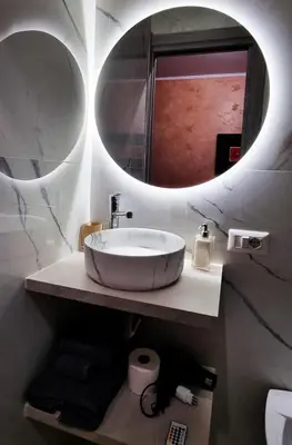 a bathroom with a sink and a mirror at Wanderlust Pietralata B&B in Rome