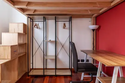 a room with a desk and a glass closet at GuestHost - Termini Live Laugh & Love Apartment in Rome