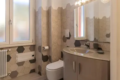 a bathroom with a sink and a toilet at GuestHost - Casa Mariu' a San Pietro in Rome