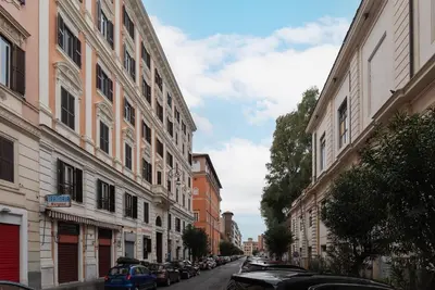 a city street with buildings and cars parked on the street at GuestHost - Casa Mariu' a San Pietro in Rome