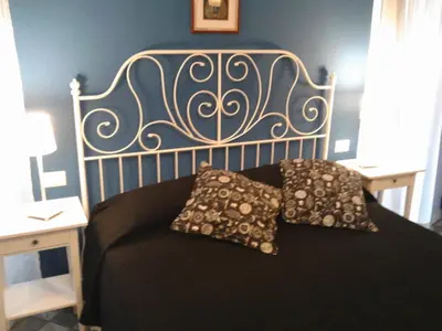 a bed with two pillows on it in a room at Le Stanze di Pietro in Rome