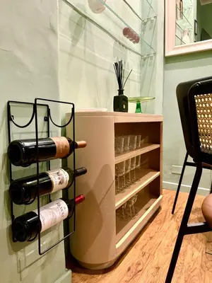 a wine rack with wine glasses in a room at Navona Penthouse - Attico Vista Cupola 4 posti in Rome