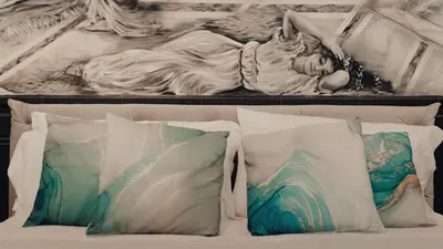 a painting of a woman laying on a bed with pillows at Mirror Suite Roma Colosseo Monti con Jacuzzi in Rome