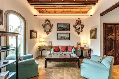 a living room with a couch and a table at Trastevere Outstanding 4 BR Terraced Apartment in Rome