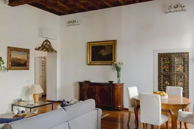 a living room with a white couch and a table at Giusi Trevi Apartment in Rome