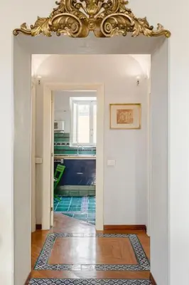 a hallway with a chandelier on the ceiling at Giusi Trevi Apartment in Rome