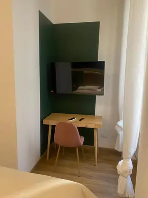 a small room with a desk and a chair at Eutierra BLeisure Stay in Rome