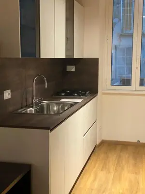a kitchen with a sink and a stove at Eutierra BLeisure Stay in Rome